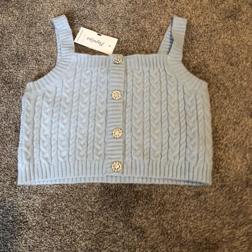 Baby blue crop sleeveless top with buttons.